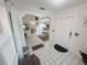 Inviting entryway with tile flooring leading to the open-concept living and dining areas at 12139 Palmetto Way, Dunnellon, FL 34432