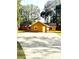 Charming single-story home featuring a concrete driveway and mature trees in a serene setting at 12139 Palmetto Way, Dunnellon, FL 34432