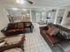 Spacious living room with an open layout showcasing the kitchen and dining areas at 12139 Palmetto Way, Dunnellon, FL 34432