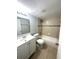 Updated bathroom featuring a clean design, a vanity, and a shower-tub combination at 5789 Windhover Dr # E03, Orlando, FL 32819
