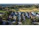 An aerial view shows the neighborhood homes and golf course at 7405 Excitement Dr, Kissimmee, FL 34747
