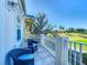 Cozy balcony with comfortable seating, offering serene views of the lush green golf course at 7405 Excitement Dr, Kissimmee, FL 34747