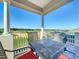 Balcony with chairs and a table that has a golf course view at 7405 Excitement Dr, Kissimmee, FL 34747