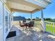 Outdoor seating on a tiled balcony with views of a golf course at 7405 Excitement Dr, Kissimmee, FL 34747