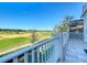 Stunning balcony view overlooking a meticulously manicured golf course under a bright blue sky at 7405 Excitement Dr, Kissimmee, FL 34747