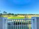 Scenic balcony view showcases a lush, well-maintained golf course on a sunny day at 7405 Excitement Dr, Kissimmee, FL 34747