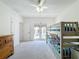 Bright bedroom featuring a bunk bed, dresser, and access to an outdoor balcony at 7405 Excitement Dr, Kissimmee, FL 34747