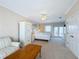Well-lit bedroom with white furniture and balcony access at 7405 Excitement Dr, Kissimmee, FL 34747