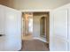 Bright hallway with white trim, neutral walls, and carpeted floors, creating a clean and inviting space at 7405 Excitement Dr, Kissimmee, FL 34747