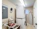 Functional laundry room with stacked washer and dryer, maximizing space and efficiency at 7405 Excitement Dr, Kissimmee, FL 34747
