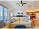 Spacious living area adjacent to the kitchen and dining area features an open concept layout at 7405 Excitement Dr, Kissimmee, FL 34747