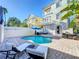 Backyard with a private pool, lounge chairs, and an outdoor dining table at 7405 Excitement Dr, Kissimmee, FL 34747