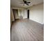 Large bedroom with mirrored closet and wood-look floors at 1609 Little Falls Cir # 79, Orlando, FL 32807