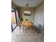 Bright dining room with wood table and modern chairs at 1609 Little Falls Cir # 79, Orlando, FL 32807