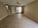 Living room with tiled floors and view of staircase at 1609 Little Falls Cir # 79, Orlando, FL 32807