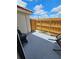 Small patio with wooden fence, grill, and patio chairs at 1609 Little Falls Cir # 79, Orlando, FL 32807