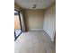 Spacious spare bedroom with tile flooring and lots of light at 1609 Little Falls Cir # 79, Orlando, FL 32807
