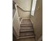 Modern stairs with wood-look flooring at 1609 Little Falls Cir # 79, Orlando, FL 32807