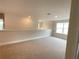 Loft area with carpeted floors and a window at 3037 Tackle Dr, Leesburg, FL 34748