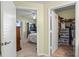 View from the bedroom doorway into the room and into the walk-in closet at 5578 Metrowest Blvd # 101, Orlando, FL 32811