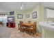 Dining area with a wooden table, chair set, and tile flooring at 5578 Metrowest Blvd # 101, Orlando, FL 32811