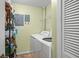 Practical laundry room with side-by-side washer and dryer for convenience at 5578 Metrowest Blvd # 101, Orlando, FL 32811