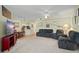 Comfortable living room with plush seating, neutral color scheme, and a ceiling fan at 5578 Metrowest Blvd # 101, Orlando, FL 32811