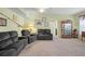 Bright living room showcasing comfortable seating, stylish decor, and archway to other rooms at 5578 Metrowest Blvd # 101, Orlando, FL 32811
