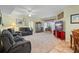 Inviting living room with a large window, and comfortable seating arrangement at 5578 Metrowest Blvd # 101, Orlando, FL 32811