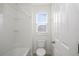 Simple bathroom with a toilet, bathtub and shower at 752 Sandy Bar Dr, Winter Garden, FL 34787