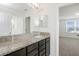 Bathroom with granite countertop and dark brown cabinets at 752 Sandy Bar Dr, Winter Garden, FL 34787