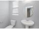 Clean bathroom with pedestal sink and oval mirror at 752 Sandy Bar Dr, Winter Garden, FL 34787