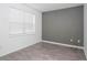 Bedroom with gray accent wall and wood-look floors at 752 Sandy Bar Dr, Winter Garden, FL 34787