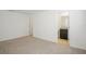 Spacious bedroom with plush carpeting and access to a full bathroom at 752 Sandy Bar Dr, Winter Garden, FL 34787