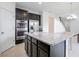 Modern kitchen with island, dark cabinets, granite countertops at 752 Sandy Bar Dr, Winter Garden, FL 34787