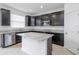 Modern kitchen with dark cabinetry, granite countertops, and island at 752 Sandy Bar Dr, Winter Garden, FL 34787