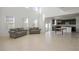 Spacious living room with tile floors and high ceilings, open to kitchen at 752 Sandy Bar Dr, Winter Garden, FL 34787