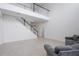 Two-story living room with gray couches and tile floors at 752 Sandy Bar Dr, Winter Garden, FL 34787
