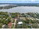 Stunning aerial view of lakefront home highlighting property lines and the beautiful surrounding landscape at 1003 Oakdale St, Windermere, FL 34786