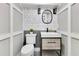 Chic powder room features a modern vanity, stylish mirror, and decorative tile accents at 1003 Oakdale St, Windermere, FL 34786