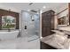 Spa-like bathroom with double vanity, large shower, and modern finishes at 1003 Oakdale St, Windermere, FL 34786