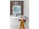 Bright bathroom featuring a modern tub, wood accent wall, and stylish lighting at 1003 Oakdale St, Windermere, FL 34786