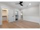 Spacious bedroom with wood flooring, access to ensuite bathroom, and closet at 1003 Oakdale St, Windermere, FL 34786