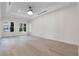Bright bedroom with tray ceiling, ample natural light, and hardwood floors for a comfortable retreat at 1003 Oakdale St, Windermere, FL 34786