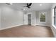 A bright bedroom with light hardwood floors, closet, and natural light at 1003 Oakdale St, Windermere, FL 34786