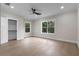 Bright bedroom features recessed lighting, hardwood floors, closet, and large windows at 1003 Oakdale St, Windermere, FL 34786