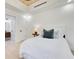 Clean bedroom featuring white walls, wood floors, and modern lighting fixtures at 1003 Oakdale St, Windermere, FL 34786