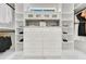 Custom closet with built-in shelving and drawers for organization and storage at 1003 Oakdale St, Windermere, FL 34786