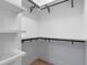 Spacious closet with built-in shelves and hanging rods at 1003 Oakdale St, Windermere, FL 34786