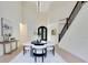 Bright dining area with modern decor, high ceilings, and statement lighting fixtures at 1003 Oakdale St, Windermere, FL 34786